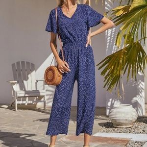 Navy polka dot jumpsuit. Brand new never worn